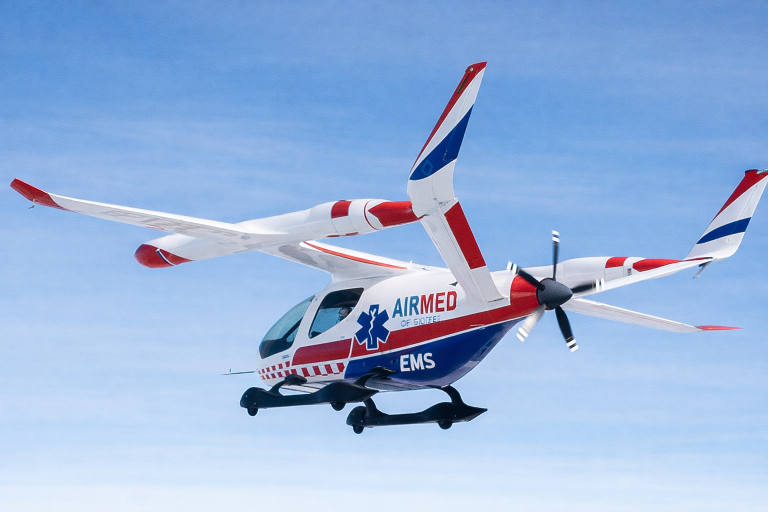 BETA Technologies ALIA electric aircraft in AirMed EMS livery — designed for medical cargo, organ transport, and emergency logistics with HHS contract support